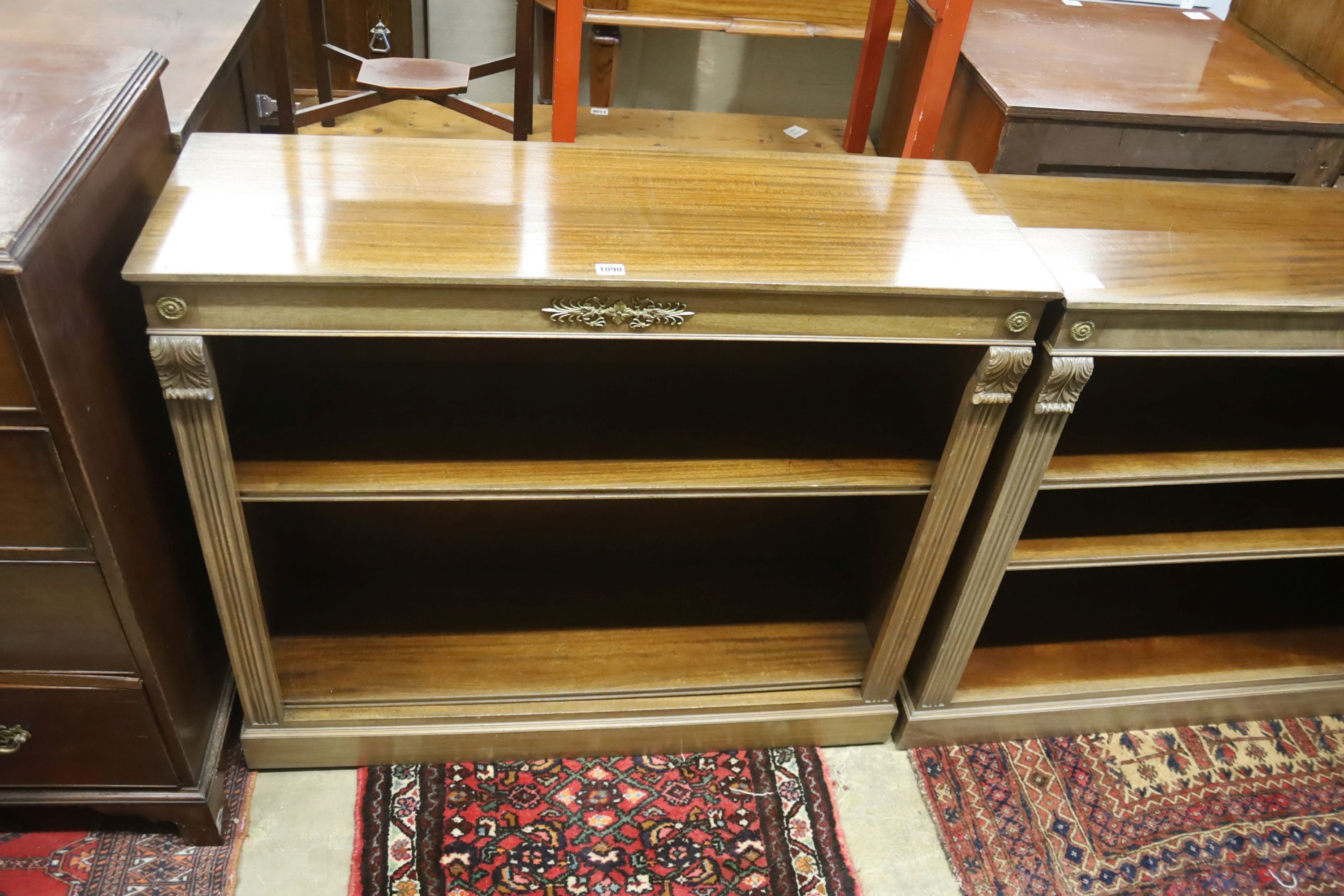 A pair of Regency style faded mahogany gilt metal mounted dwarf open bookcases, width 107cm, depth 34cm, height 93cm